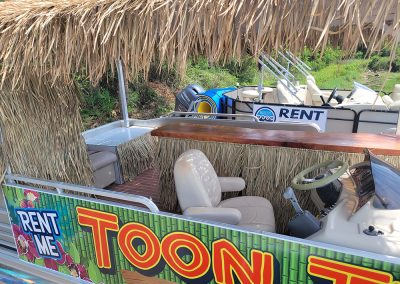 Driver seat view of a tiki pontoon party boat rental in Orange Beach Alabama