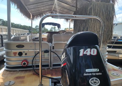 A rear view of a tiki pontoon boat rental in Orange Beach Alabama